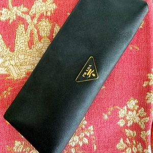 Prada Black clutch with Gold Emblem